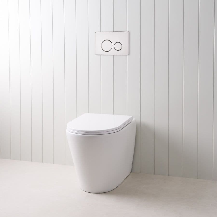Angled In-Wall Toilet With Round Chrome Buttons