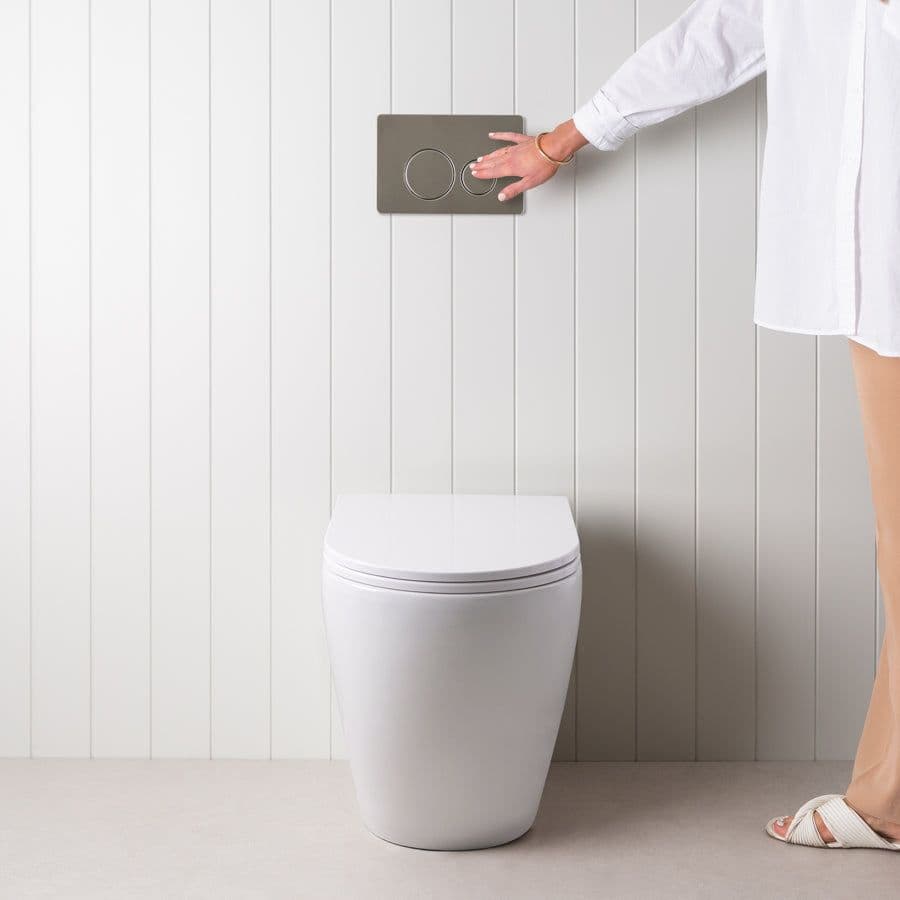 Curved In-Wall Toilet With Round Stainless Steel Buttons