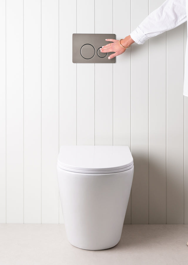 Angled In-Wall Toilet With Round Gunmetal Buttons