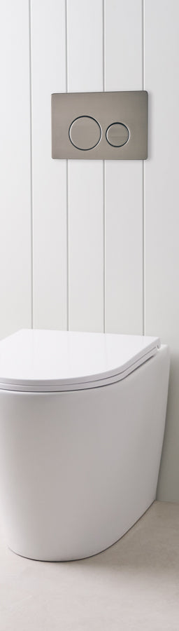 Angled In-Wall Toilet With Round Gunmetal Buttons