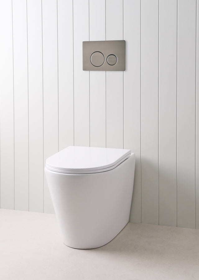 Angled In-Wall Toilet With Round Gunmetal Buttons