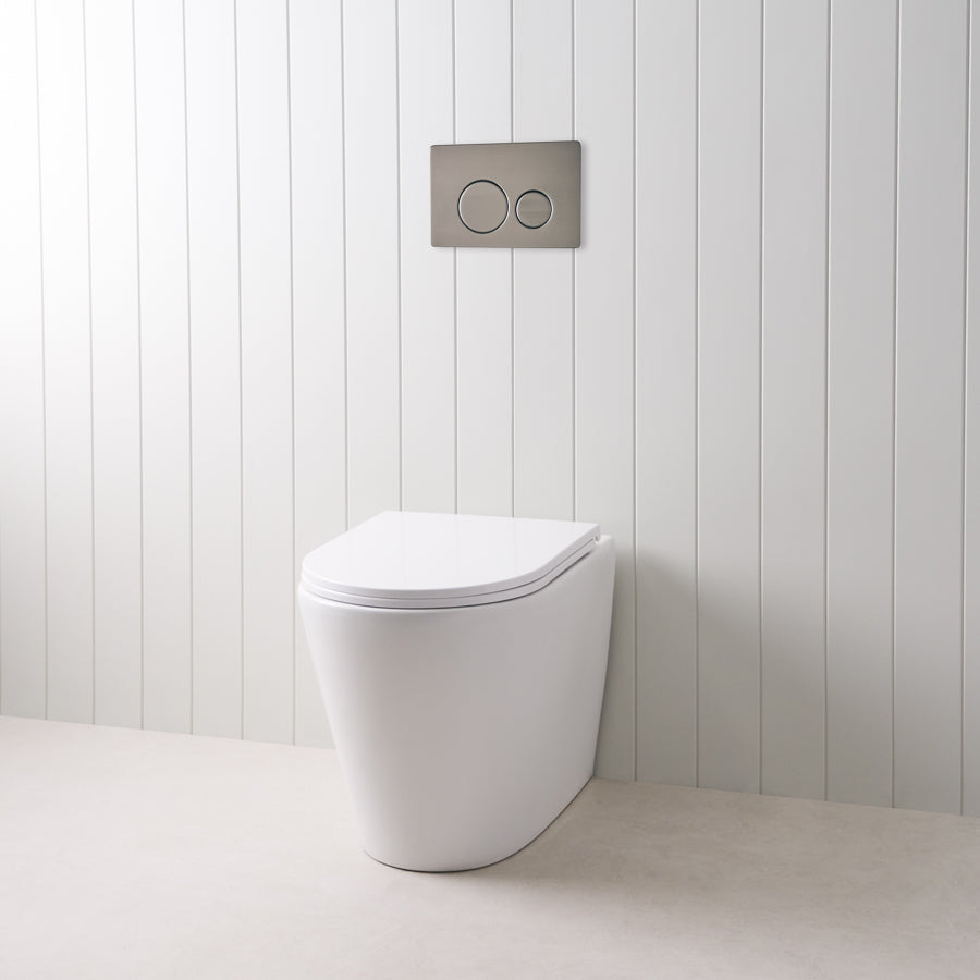 Angled In-Wall Toilet With Round Gunmetal Buttons