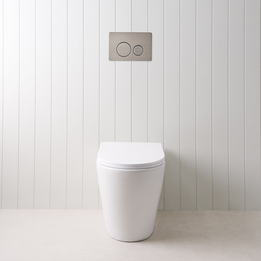 Angled In-Wall Toilet With Round Gunmetal Buttons