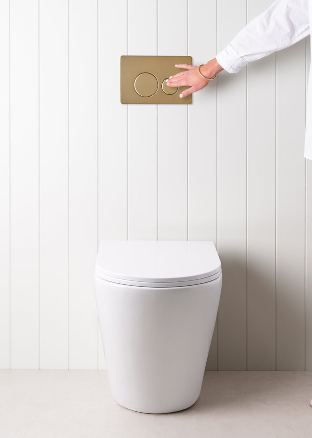 Angled In-Wall Toilet With Round Warm Brushed Nickel Buttons