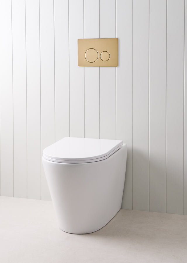 Angled In-Wall Toilet With Round Warm Brushed Nickel Buttons