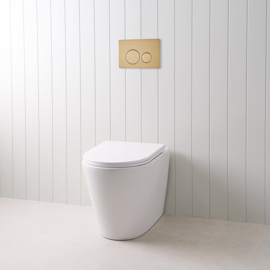 Angled In-Wall Toilet With Round Warm Brushed Nickel Buttons