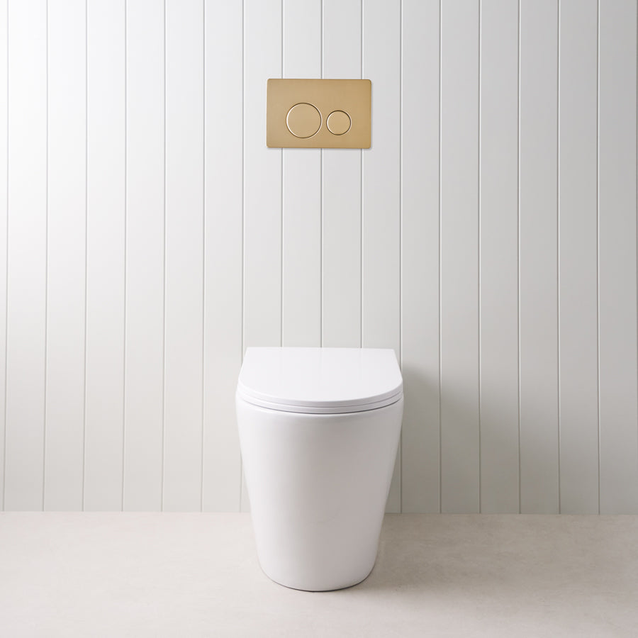 Angled In-Wall Toilet With Round Warm Brushed Nickel Buttons