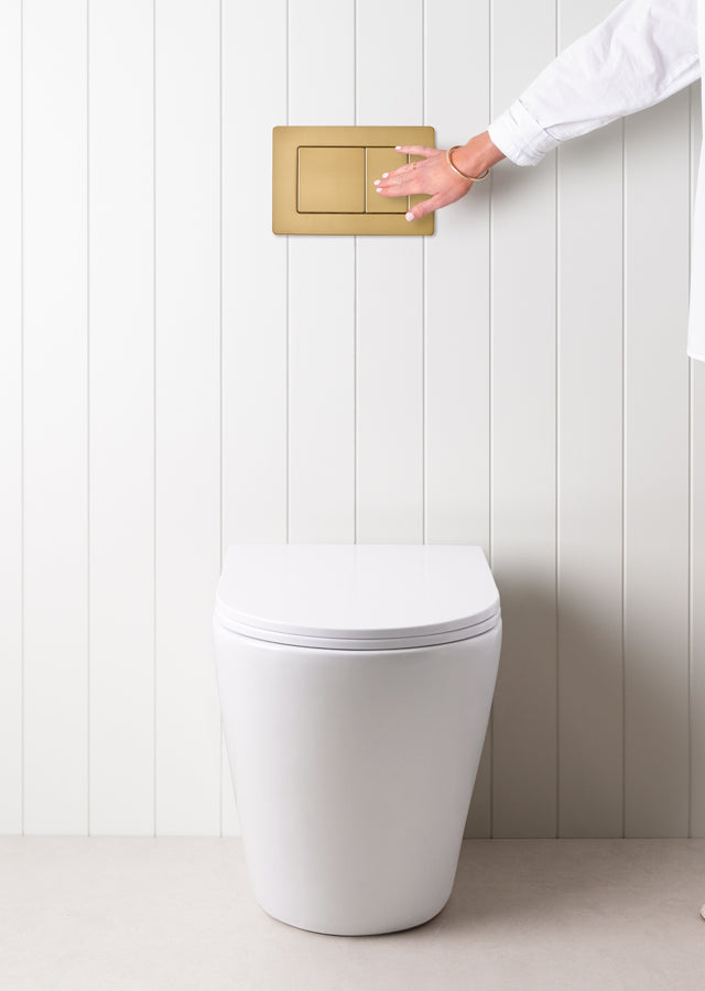 Angled In-Wall Toilet With Rectangle Brushed Brass Buttons