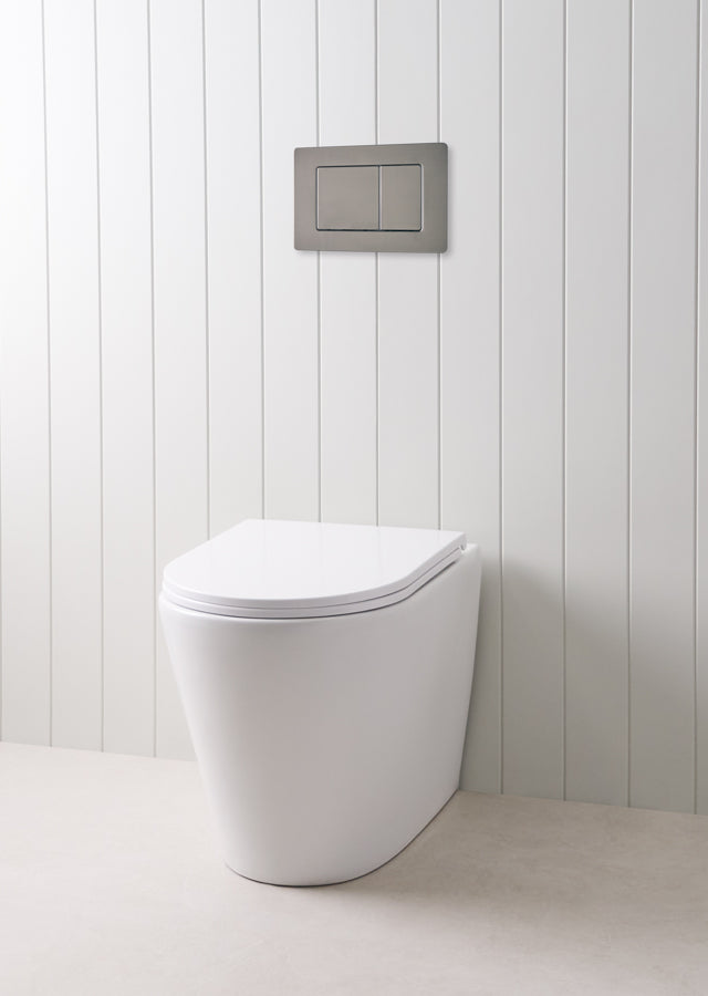 Angled In-Wall Toilet With Rectangle Gunmetal Buttons