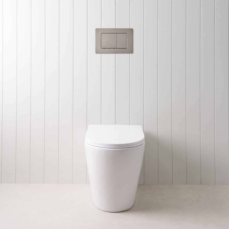 Angled In-Wall Toilet With Rectangle Gunmetal Buttons