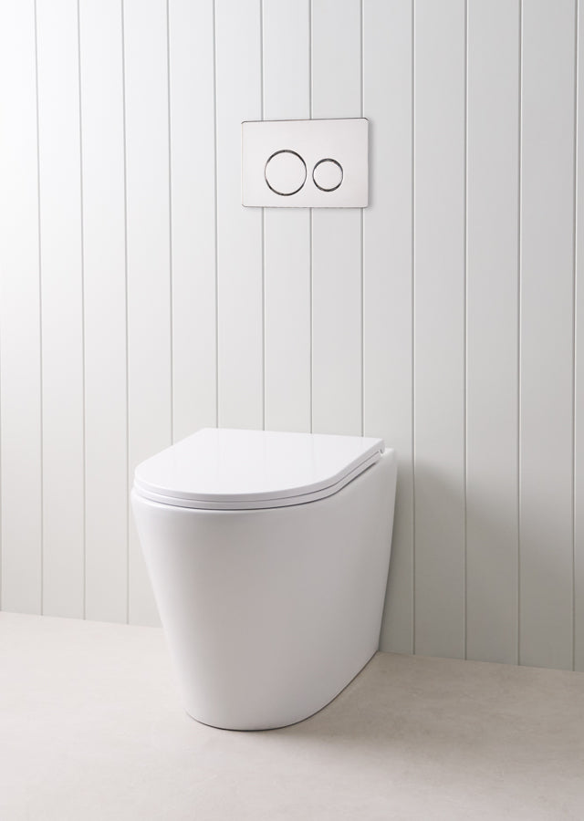 Angled In-Wall Toilet With Round Chrome Buttons