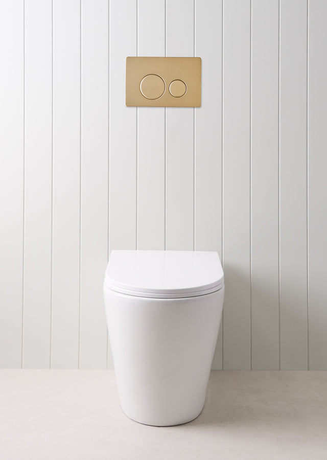 Angled In-Wall Toilet With Round Warm Brushed Nickel Buttons
