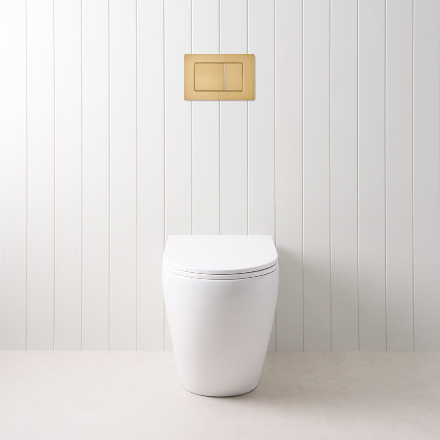 Curved In-Wall Toilet With Rectangle Brushed Brass Buttons