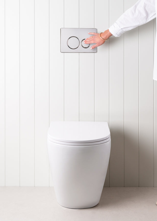 Curved In-Wall Toilet With Round Chrome Buttons