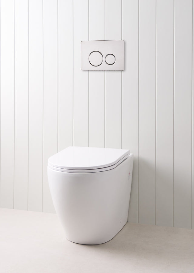 Curved In-Wall Toilet With Round Chrome Buttons