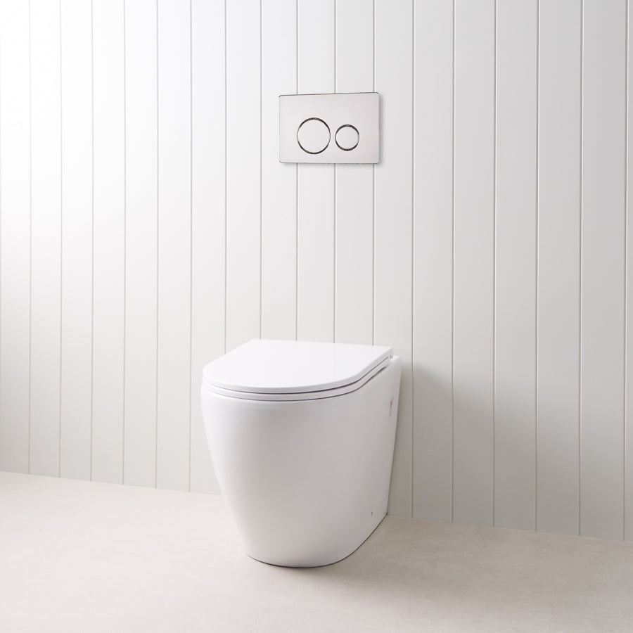 Curved In-Wall Toilet With Round Chrome Buttons