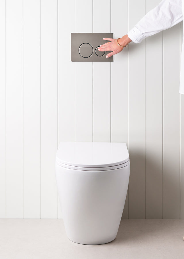 Curved In-Wall Toilet With Round Gunmetal Buttons