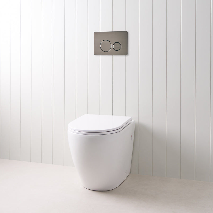 Curved In-Wall Toilet With Round Gunmetal Buttons