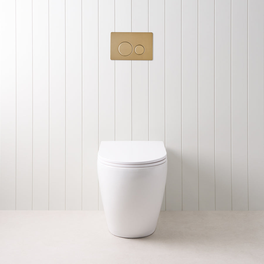 Curved In-Wall Toilet With Round Warm Brushed Nickel Buttons