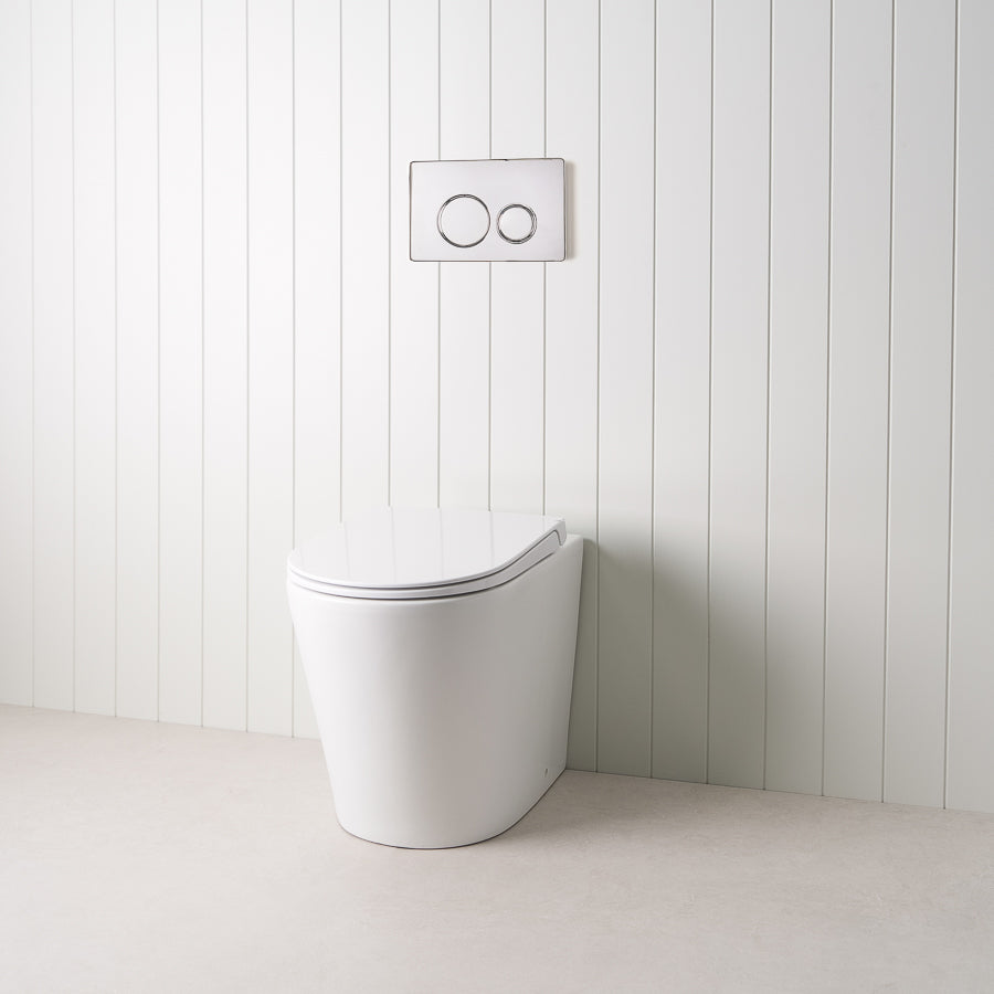 Angled In-Wall Toilet With Round Chrome Buttons
