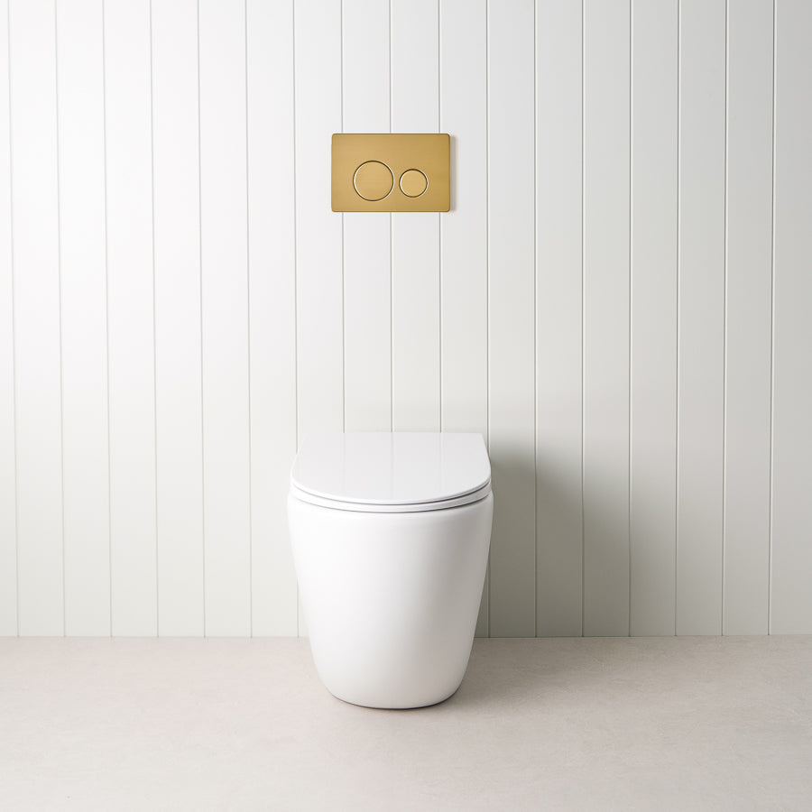Curved In-Wall Toilet With Rectangle Brushed Brass Buttons