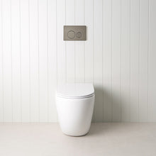 Curved In-Wall Toilet With Round Gunmetal Buttons