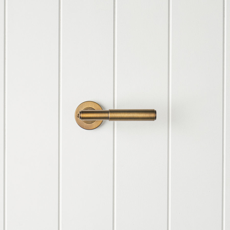 Melbourne Door Handle with Lock Antique Brass