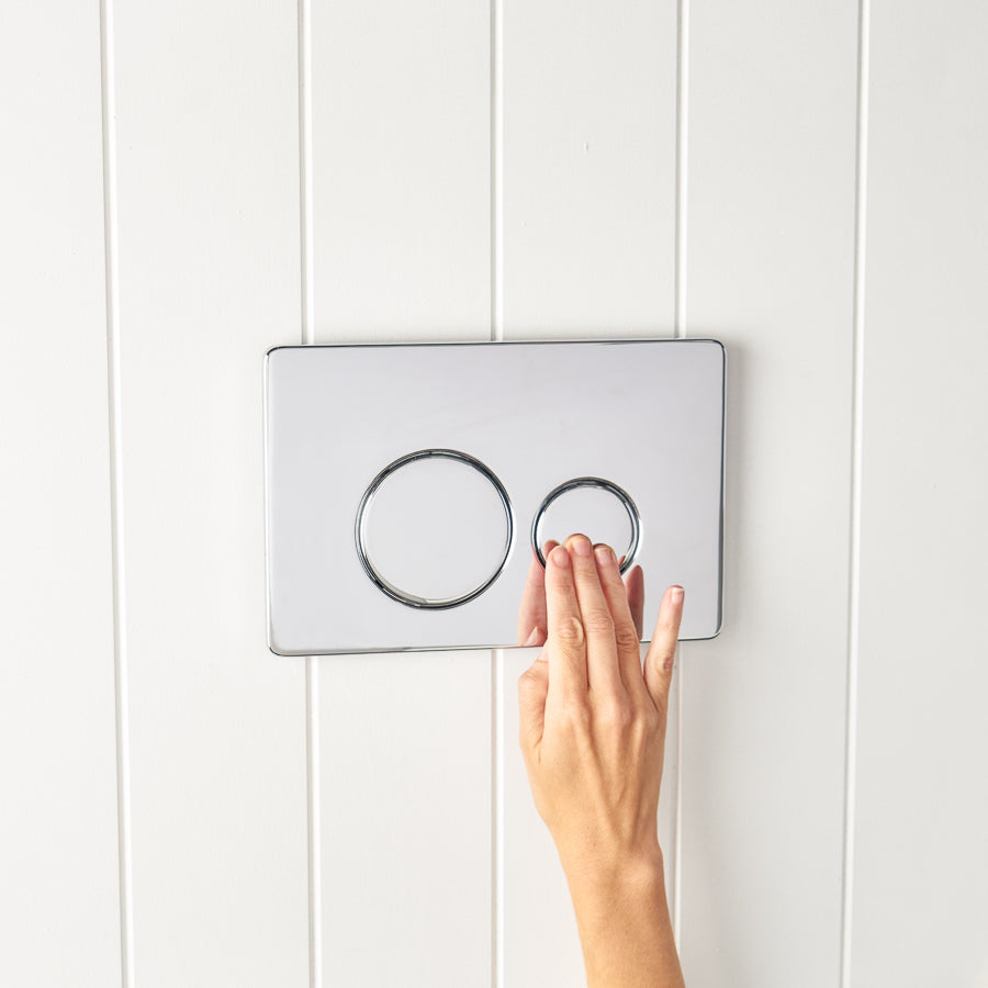 Angled In-Wall Toilet With Round Chrome Buttons