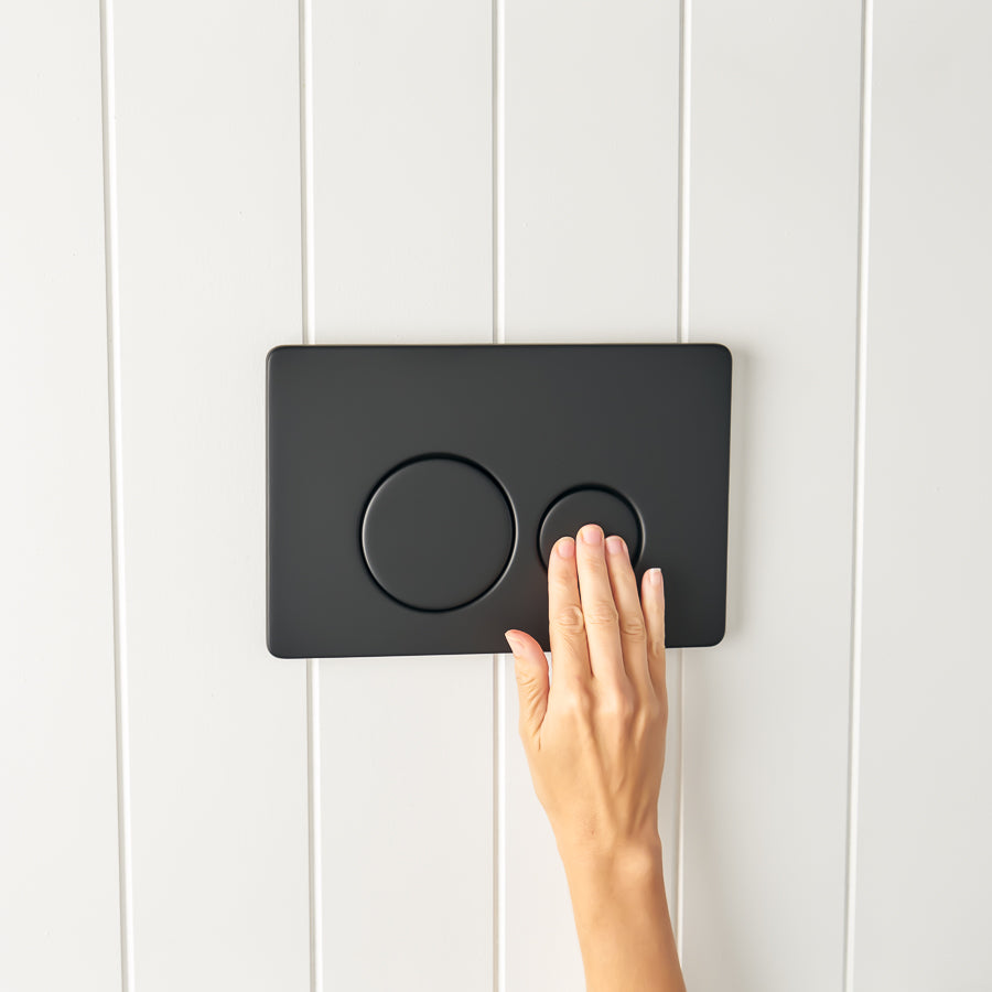 Curved In-Wall Toilet With Round Matte Black Buttons