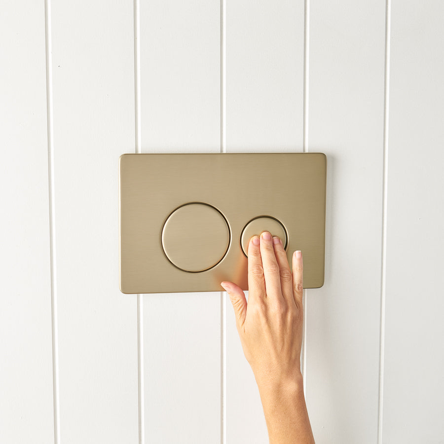 Curved In-Wall Toilet With Round Warm Brushed Nickel Buttons